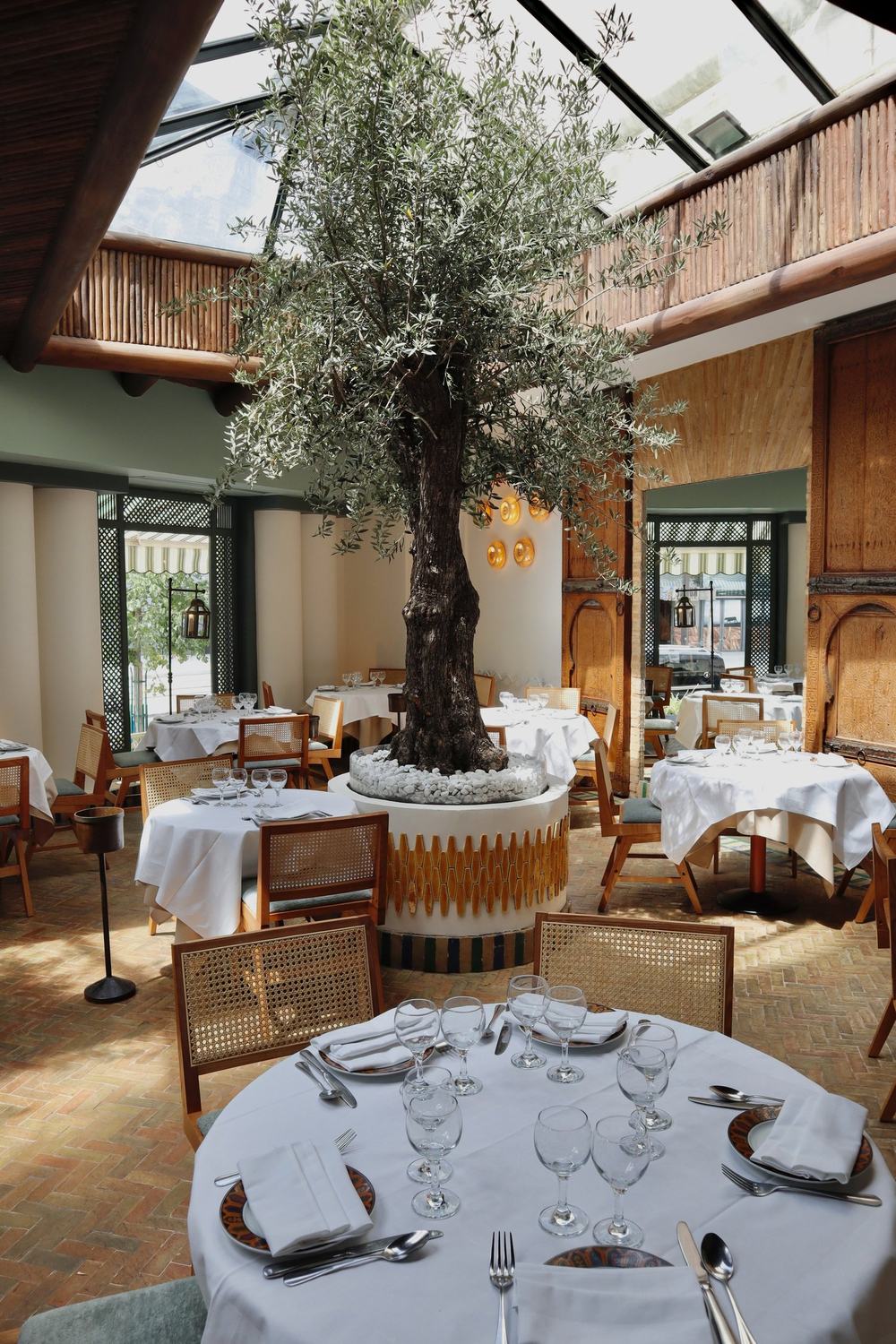 Dining room with a central tree